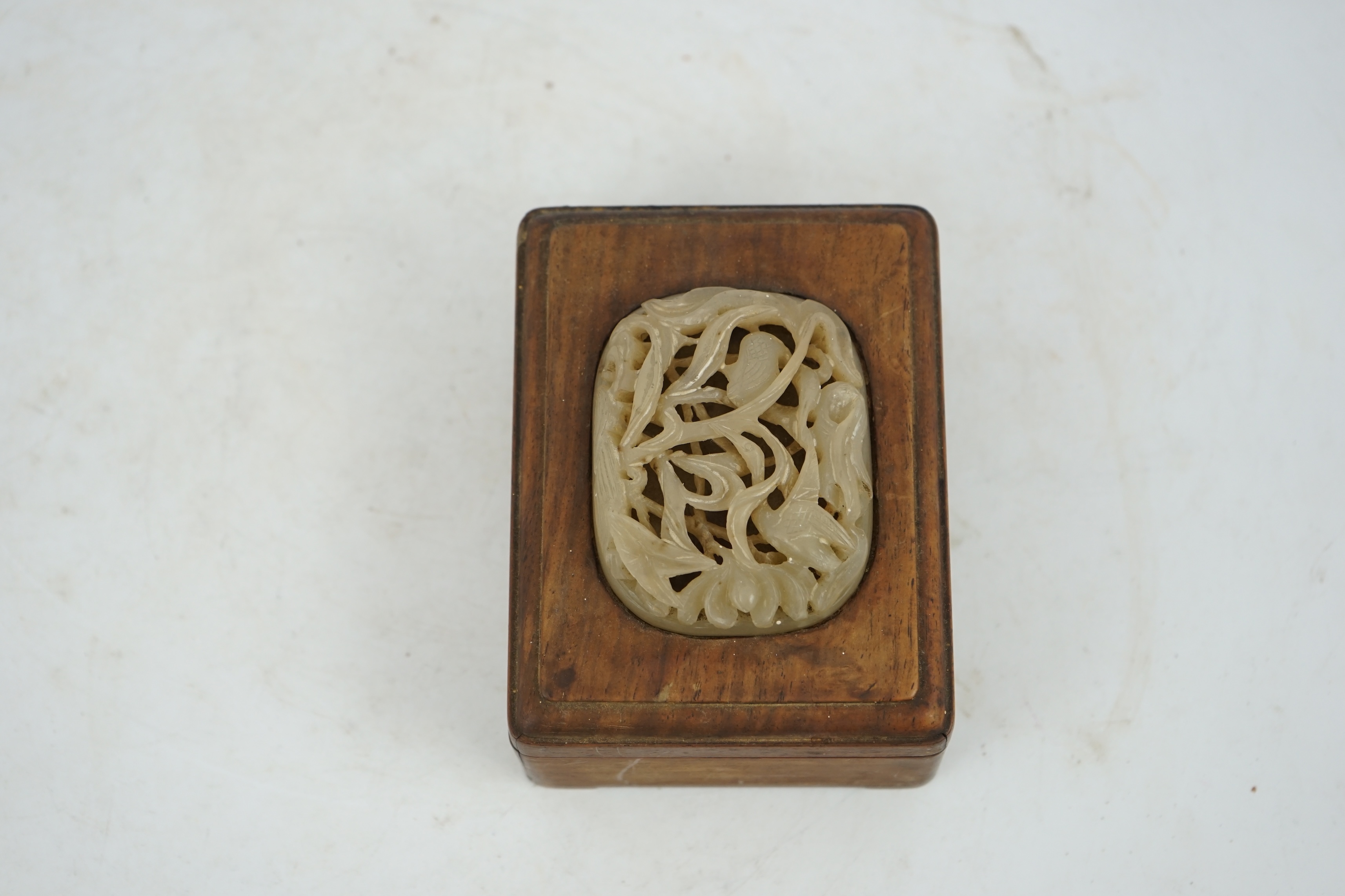 A Chinese pale creamy white jade ‘egret and lotus’ plaque, Yuan-Ming dynasty